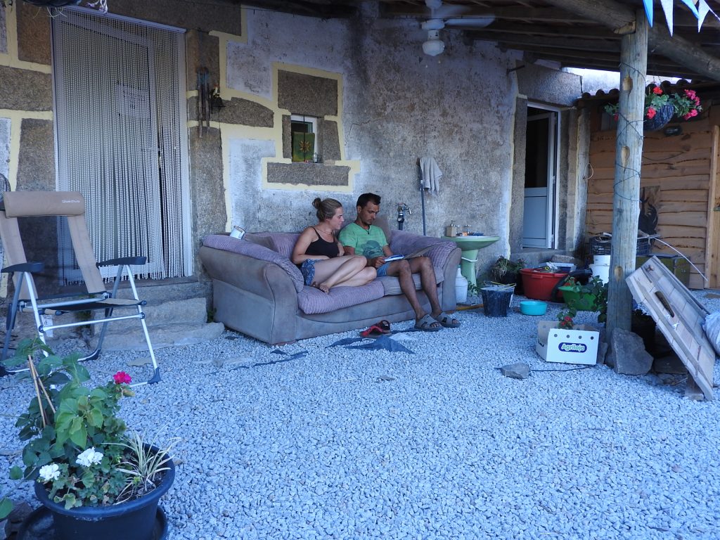 Relaxing on the sofa outside in the courtyard
