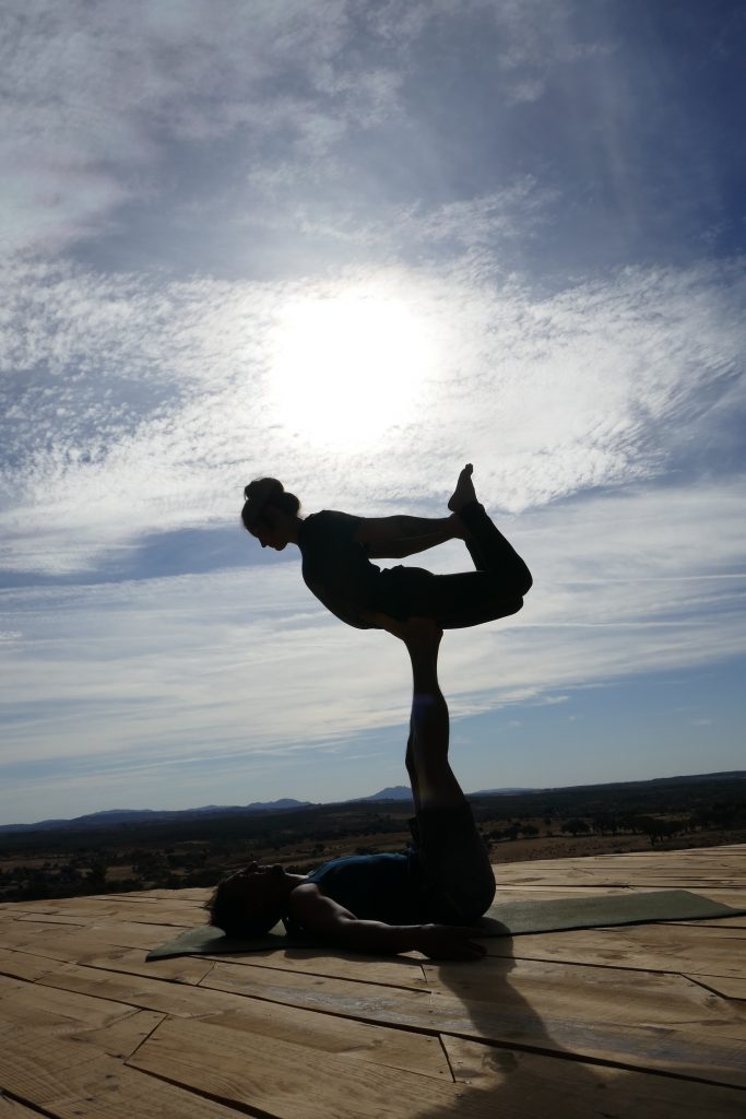 Acro yoga fun on the yoga deck