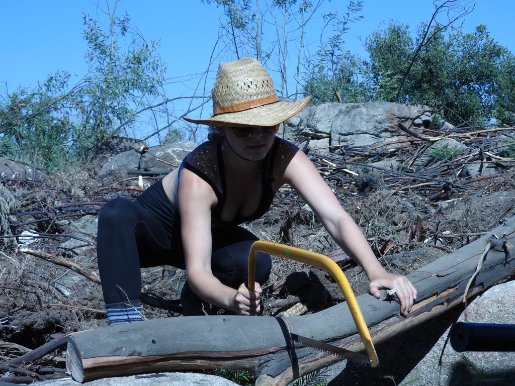 Cutting fire wood for our hot showers