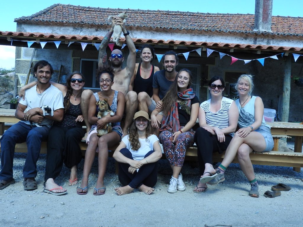 A group of volunteers during the summer in the courtyard of the community house