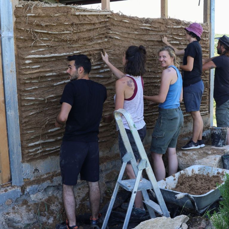 Natural Building - Plastering wattle and daub outside yoga room