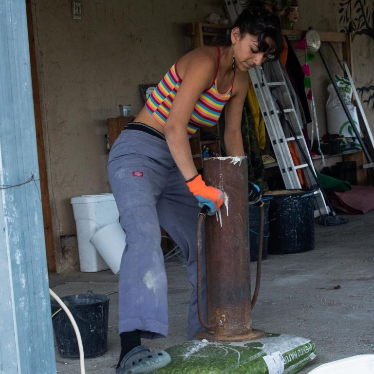 Natural Building - Tamping down earth bags